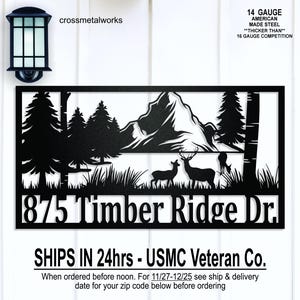May include: Black metal sign with a mountain and deer scene, the text "875 Timber Ridge Dr" is displayed. The sign is made of 14-gauge American-made steel. The text "crossmetalworks" is displayed at the top.