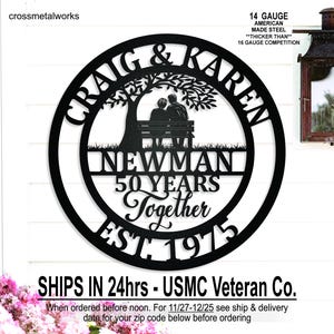 May include: Black metal wall art with the names "Craig & Karen" and "Newman" in a circular design. The art features a couple on a bench under a tree, with "50 Years Together EST. 1975" below. The text "14 GAUGE AMERICAN MADE STEEL" is also visible.
