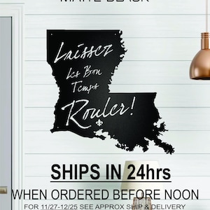 May include: A black chalkboard shaped like the state of Louisiana with the text "Laissez Let Bon Tempt Rouler!" written in white chalk. The chalkboard is mounted on a white wall. The text "SHIPS IN 24hrs WHEN ORDERED BEFORE NOON FOR 11/27-12/25 SEE APPROX SHIP & DELIVERY DATE FOR YOUR ZIP CODE BELOW BEFORE ORDERING" is printed below the chalkboard.