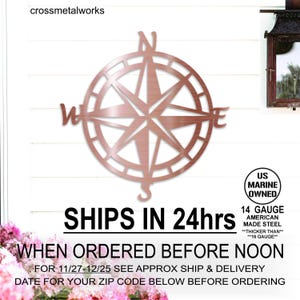 May include: A rose gold metal compass with the letters N, S, E, and W. The compass is mounted on a white wooden wall. The text "SHIPS IN 24hrs WHEN ORDERED BEFORE NOON FOR 11/27-12/25 SEE APPROX SHIP & DELIVERY DATE FOR YOUR ZIP CODE BELOW BEFORE ORDERING" is below the compass.
