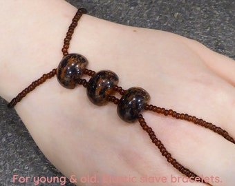 Goldstone & Blue Sandstone. Man made spacer bars. Topaz elastic slave bracelet. Hand bracelet. Finger bracelet. Hand jewelry. Hand chain.