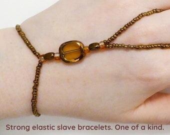 Copper window bead. Orange elastic slave bracelet. Finger jewelry. Finger bracelet. Hand jewelry. Ring bracelet. Hand bracelet. Hand chain.