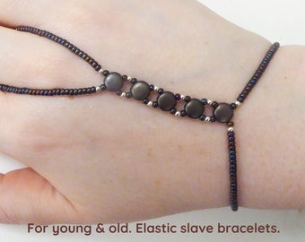 Dark bronze metallic matte Disc Duo glass beads. Silver plated elastic slave bracelet. Finger jewelry. Finger bracelet. Hand jewelry.