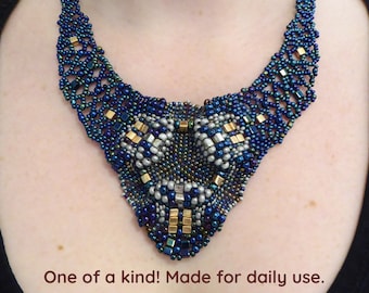 Beadwork 3D necklace. Free form blue metallic statement necklace. Nickel free gold colored clasp. Beaded bib necklace. seed beads