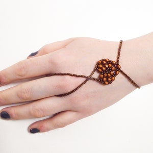 Matte orange copper metallic faceted heart. Elastic slave bracelet. Bronze metallic seed beads. Ring bracelet. Hand jewelry Finger jewelry image 3