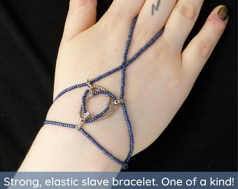 Silver metal links. Blue metallic elastic slave bracelet. Beaded Bracelet ring. Hand jewellery. Finger bracelet. Ring bracelet. Hand chain.
