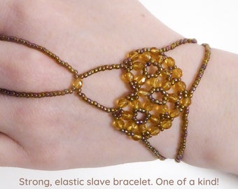 Faceted dark yellow beads. Elastic slave bracelet. Gold luster dark topaz  seed beads. Ring bracelet. Hand finger jewelry.