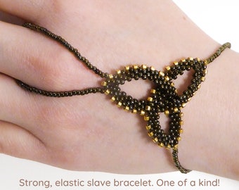 Brown iris metallic Celtic Knot. Elastic slave bracelet. Beaded hand finger jewelry. Beadwork finger bracelet. Hand jewelry. Ring bracelet.
