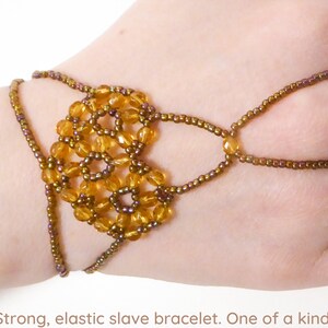 Faceted dark yellow beads. Elastic slave bracelet. Gold luster dark topaz seed beads. Ring bracelet. Hand finger jewelry. image 1