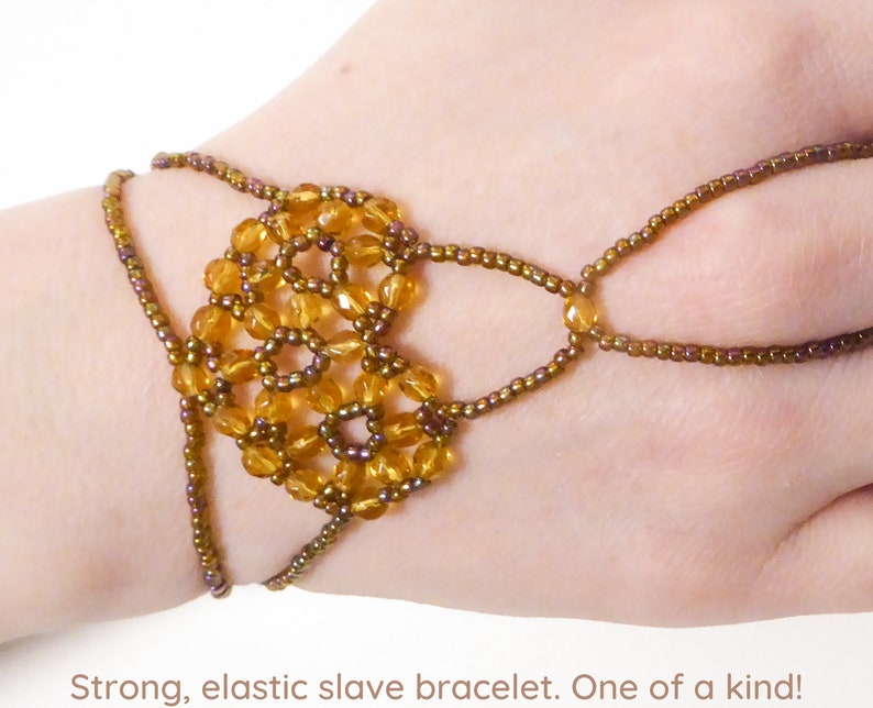 Faceted dark yellow beads. Elastic slave bracelet. Gold luster dark topaz seed beads. Ring bracelet. Hand finger jewelry. image 1