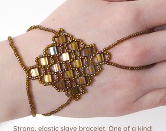 Gold iris rainbow Tila beads. Elastic slave bracelet. Gold luster dark topaz rainbow seed beads. Beaded Finger bracelet. Hand jewelry.