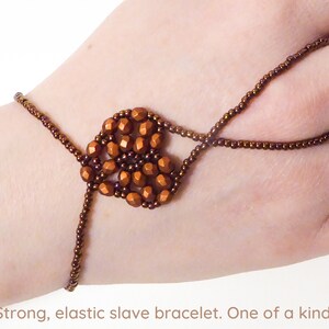 Matte orange copper metallic faceted heart. Elastic slave bracelet. Bronze metallic seed beads. Ring bracelet. Hand jewelry Finger jewelry image 1