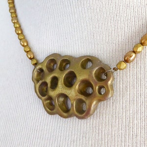 Gold polymer clay in a 3D net. Beautiful gold colored freshwater pearls. Faceted gold colored glass beads. Bronze colored clasp and chain. image 9