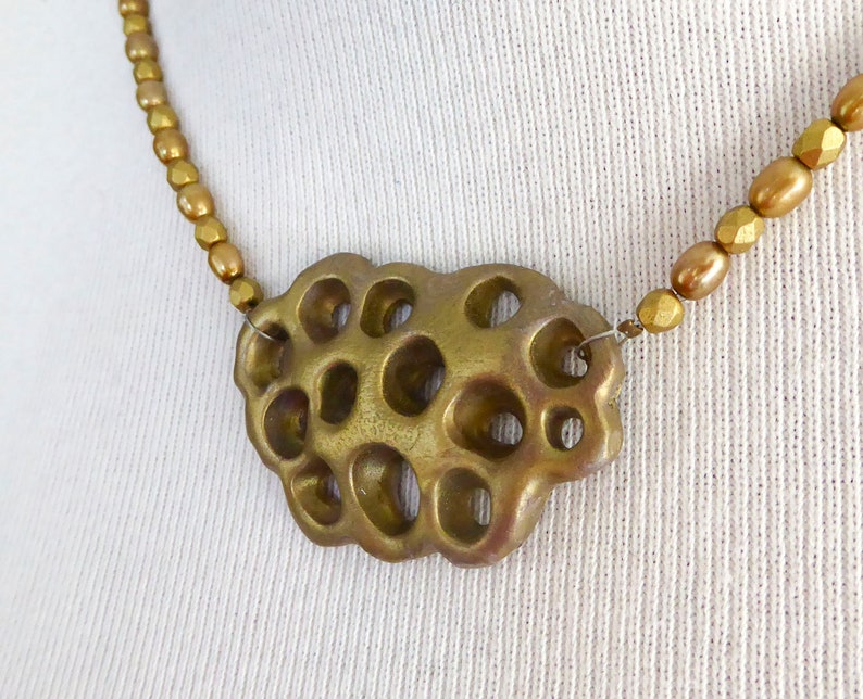 Gold polymer clay in a 3D net. Beautiful gold colored freshwater pearls. Faceted gold colored glass beads. Bronze colored clasp and chain. image 9