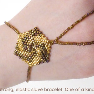 Hexagonal spiral beadwork. Elastic slave bracelet. Gold iris metallic delica beads. Beaded hand finger jewelry. Hand jewelry. Ring bracelet. image 1