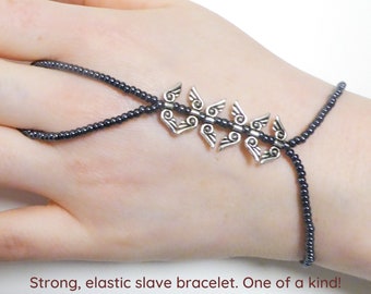 Nickel free silver plated angel wings. Hematite metallic elastic slave bracelet. Beaded bracelets ring. Finger bracelet. Hand jewelry.