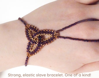 Purple gold metallic Celtic knot beadwork. Elastic slave bracelet. Bright copper plated delica beads. Beaded finger bracelet. Ring bracelet.