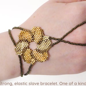 Flower beadwork with different gold iris metallic delica beads. Elastic slave bracelet. Gold plated metallic delica beads. Ring bracelet. image 1