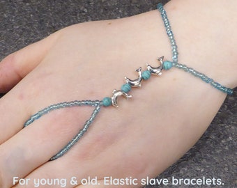 Natural Turquoise beads & Dolphins in nickel free silver metal. Elastic gemstone animal slave bracelet. Semi precious stone. Crystal.