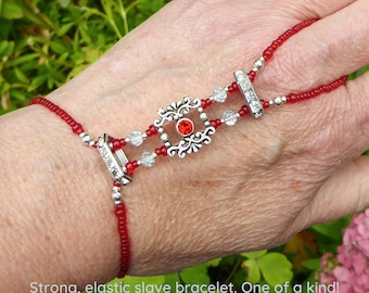 Red crystal in silver plated Swarovski spacer bars. Elastic slave bracelet. Beaded Bracelet ring. Hand jewellery. Ring bracelet. Hand chain.