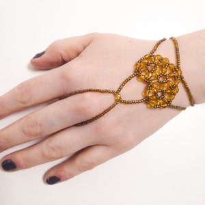 Faceted dark yellow beads. Elastic slave bracelet. Gold luster dark topaz seed beads. Ring bracelet. Hand finger jewelry. image 3