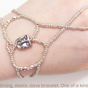 Silver plated face and faceted beads. Elastic slave bracelet. Hand finger jewelry. Bracelet ring. Finger bracelet. Hand chain.