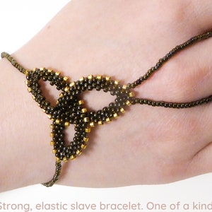 Brown iris metallic Celtic Knot. Elastic slave bracelet. Beaded hand finger jewelry. Beadwork finger bracelet. Hand jewelry. Ring bracelet. image 1