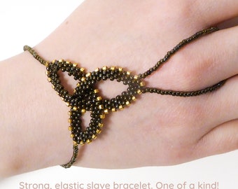 Brown iris metallic Celtic Knot. Elastic slave bracelet. Beaded hand finger jewelry. Beadwork finger bracelet. Hand jewelry. Ring bracelet.