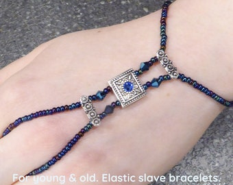 Blue crystal, silver plated Swarovski spacer bars. Blue metallic elastic slave bracelet. Beaded Finger bracelet. Ring bracelet. Hand chain.