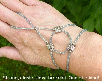 Silver metal links. Gray elastic slave bracelet. Beaded Bracelet ring. Hand jewellery. Finger bracelet. Ring bracelet. Hand chain ring.