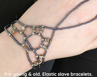 Silver metallic elastic slave bracelet. Beaded Hand finger jewelry. Finger bracelet. Hand jewelry. Ring bracelet. Hand bracelet. Hand chain.