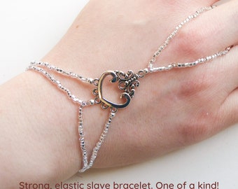 Nickel free silver colored metal connector. Silver plated metal beads. Elastic slave bracelet. Hand jewelry. Ring bracelet. Hand bracelet.
