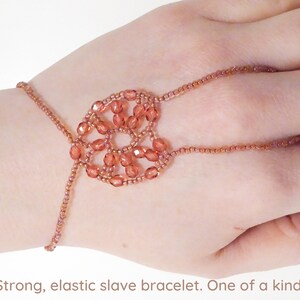 Orange pink faceted heart. Elastic slave bracelet. Terracotta lined crystal luster seed bead. Ring bracelet. Hand jewelry. Finger jewelry. image 1