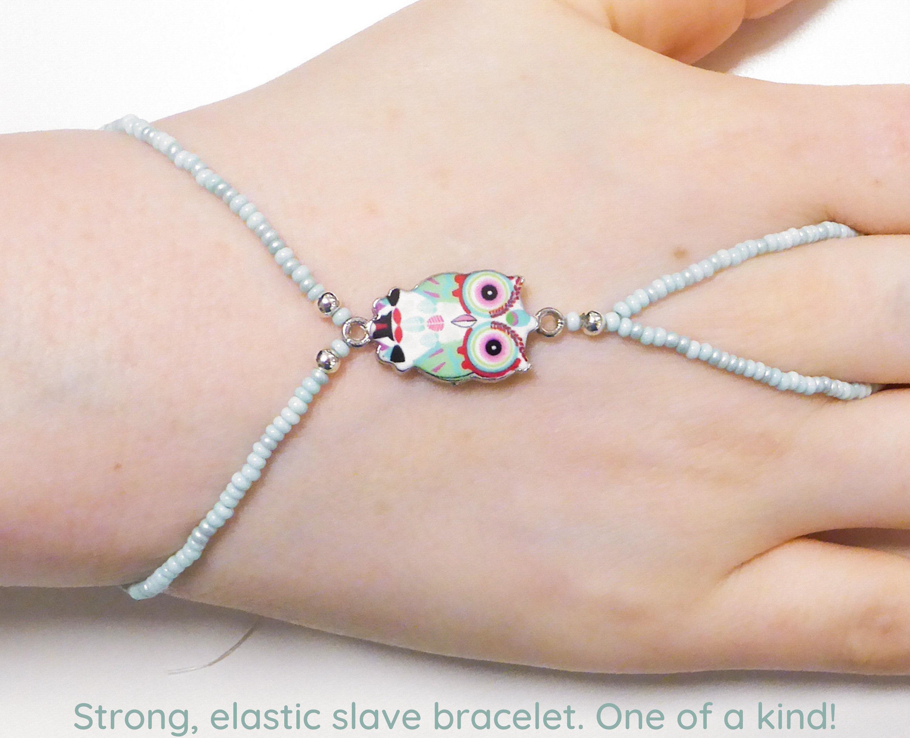 Cute turquoise red nickel free enamel owl. Pale turquoise elastic animal slave bracelet. Beaded stre