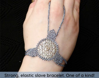 Silver metal circle elastic slave bracelet. Hand finger jewelry. Finger bracelet. Hand jewelry. Ring bracelet. Hand bracelet. Hand chain.