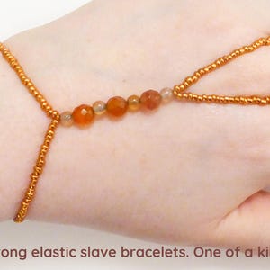 Natural faceted Carnelian crystals. Agate elastic gemstone slave bracelet. Hand finger jewelry. Semi precious stone bracelet. Hand jewellery