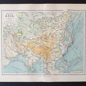 May include: A detailed vintage physical map of Asia, showing geographical features. The map uses a colour-coded system to represent land elevations and water depths. The title "PHYSICAL MAP OF ASIA" is printed at the top.