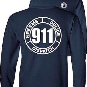 May include: Navy blue long-sleeve shirt with a white graphic on the back that says "911 DISPATCH" in a circular design. The design includes the words "FIRE/EMS" and "POLICE". A smaller version of the graphic is on the front.
