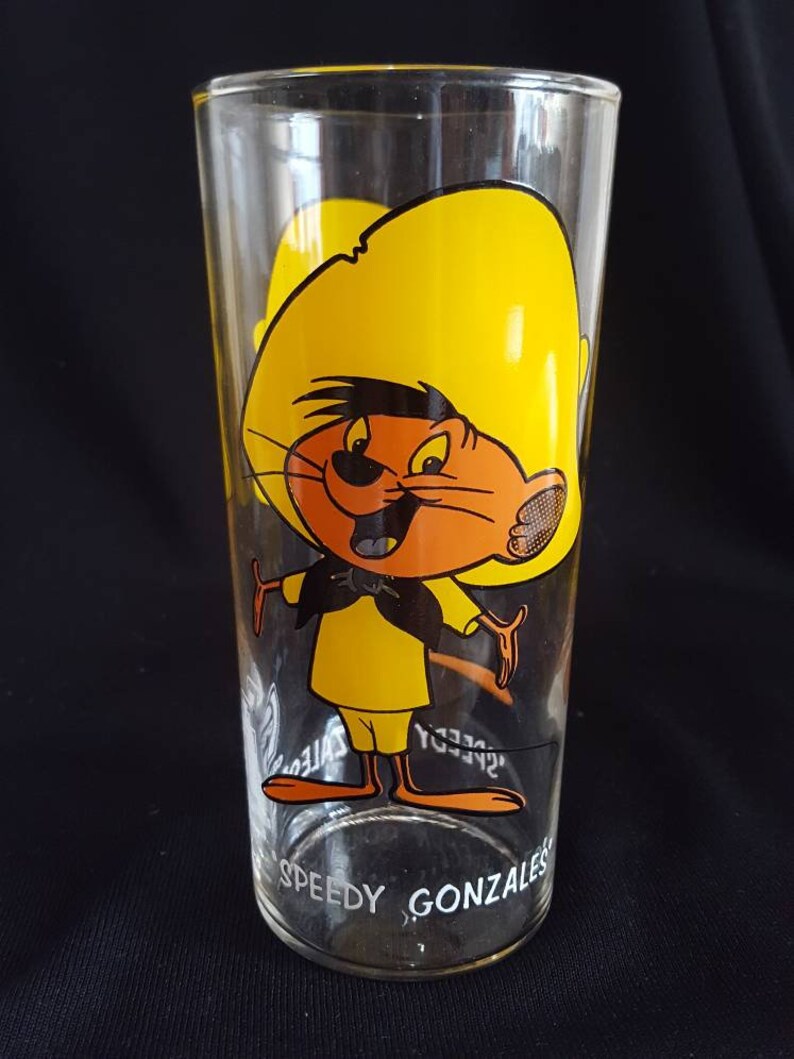 original thin glassware with white lettering. Set of 2 Warner Brothers Sylvester and Speedy Gonzales Tumblers