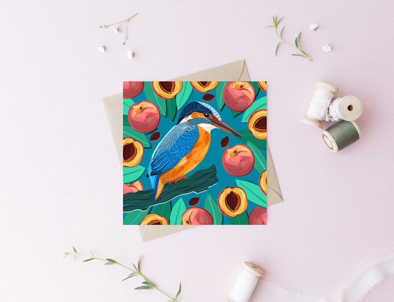 May include: A blue and orange kingfisher bird perched on a branch surrounded by peach slices on a teal background.