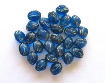 Lot of fifteen oval 10 x 9mm Czech glass snail beads - translucent capri blue and gold carved glass snail beads C12101