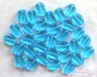 25 transparent Aqua Blue flat oval Czech Glass  beads, 12mm x 9mm pressed glass beads C7425