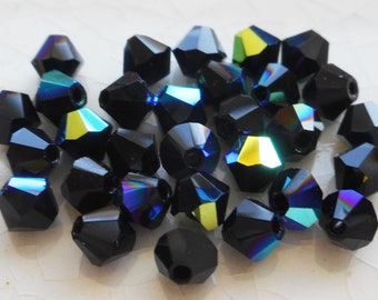 Lot de 24 perles de toupie à facettes en verre opaque tchèque Jet Black AB de 4 mm, toupies Preciosa Crystal black AB 9401