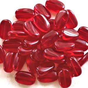 Lot of 15 transparent light garnet, ruby Red slightly twisted oval Czech Glass beads, 14mm x 8mm pressed glass beads C0047