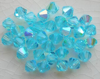 thumbnail image 2 of 98 Pieces 4mm Aqua Blue Crystal Glass Bicone Beads – Spacer Beads 2 of 6