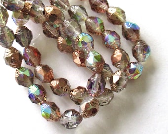 15 Czech glass mini antique style faceted oval beads - 8 x 6mm crystal clear beads with copper and rainbow ab finishes - C00071