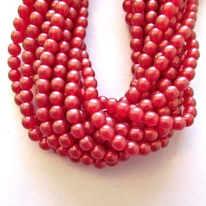 Fifty 6mm Czech glass druk beads - Cosmic Twinkle Siam Ruby Red smooth round druks - C0009