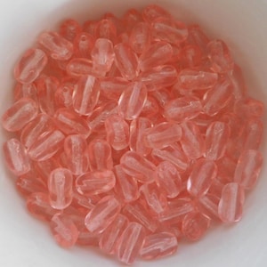 25 9mm x 6mm light pink Czech glass twisted oval beads C0044