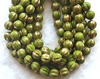 25 Czech pressed glass melon beads.  6mm Avocado Green with gold accents, C00101