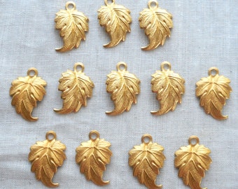 12 raw brass leaf, leaves pendants, charms, brass stampings, with ring .75" in by .50" in. made in the USA 76301